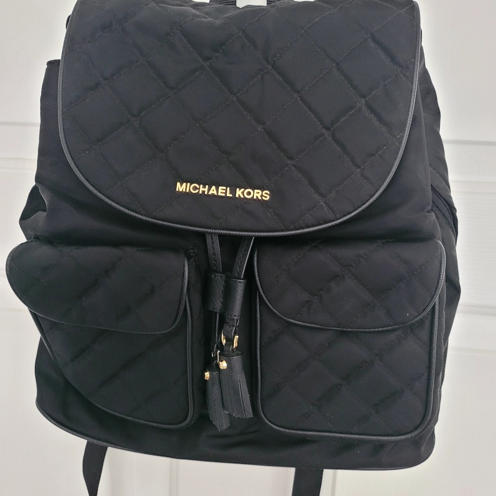 Michael Kors, Black/Gold back-pack purse.